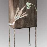 Cabinet in bronze feet and bronze texture on the doors model Algae by Christine Rouviere.