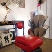 Pair of red armchairs by François Arnal