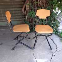 pair of wood and metal chairs