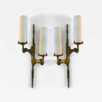Pair or set of two Mid-Century Modern wall sconces by Maison Arlus. Cast gilt bronze and opaline glass. Rare model, beautiful patina. Original documentation available upon request. Renowned manufacturers such as Stilnovo, Arteluce, Arredoluce, Maison Jansen, Charles, Hollywood Regency, and Felix Agostini.