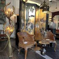 pair of armchairs and Chinese screen