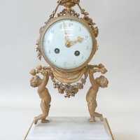 Pendule en marbre blanc et bronze doré du XIXème siècle