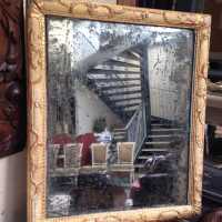 Miroir de boiserie, avec un décor à la Bérain, fin XVIIe siècle