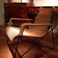 Fauteuil de Raoul Guys, rotin et piètement tubulaire en métal, Airborne, France, circa 1950