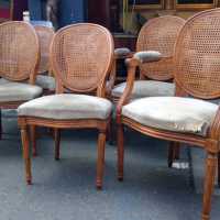 Série de quatre chaises et deux fauteuils de style Louis XVI, noyer, dossiers cannés, France, ca 1900