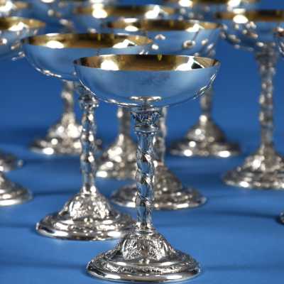 12 champagne glasses in sterling silver and gold
