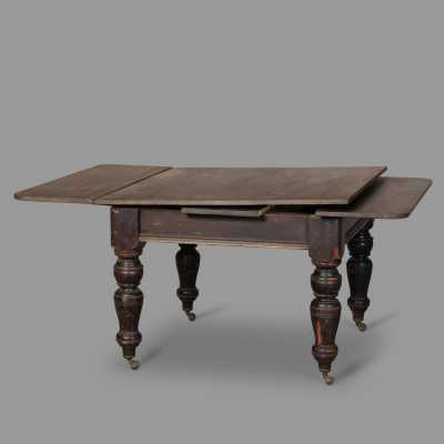 Extendable blackened wood table