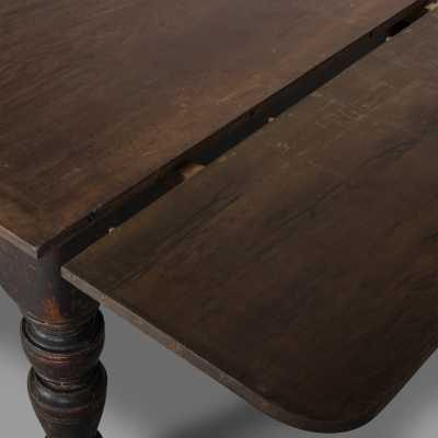 Extendable blackened wood table