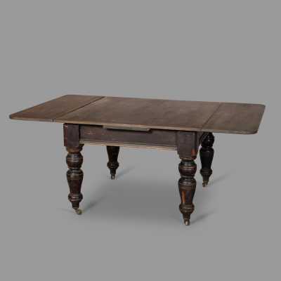 Extendable blackened wood table