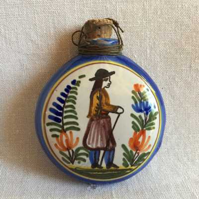 On the other side a breton man surrounded by flowering leaves ferns