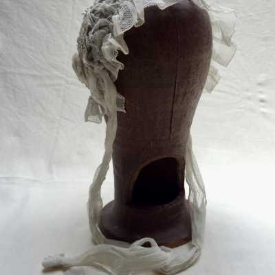 Warm up by embers placed inside, the lace headdresses were placed above to iron them (or wigs to style them in late eighteenth)