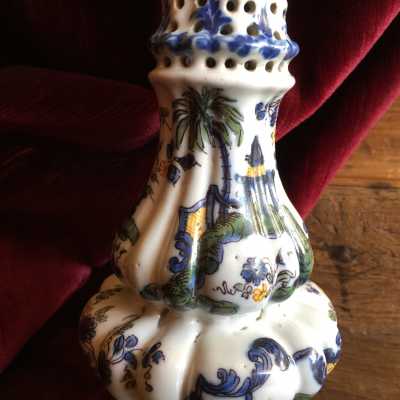 Baluster shape with dented body, landscape scenery surrounded by garlands of foliated flowers in polychrome of great fire