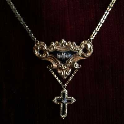 Necklace with chain and pendant decorated with scrolls and a cross, decorated with bressans enamels black with jewels set