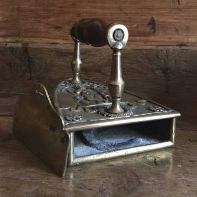 A sliding door closed the iron, inside an S serving as an ingot-rest
