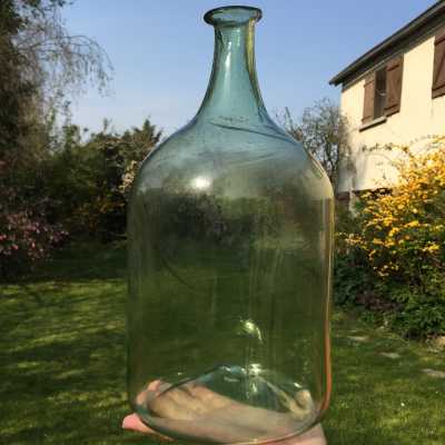 Slightly green translucent glassware, traces of the glassmaker's movement in the glass during blowing, beautiful transparency, light in hand