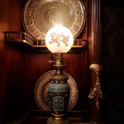 Pair of porcelain lamps with Baccarat globe, around 1880