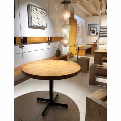 Round pine table by Charlotte Perriand.