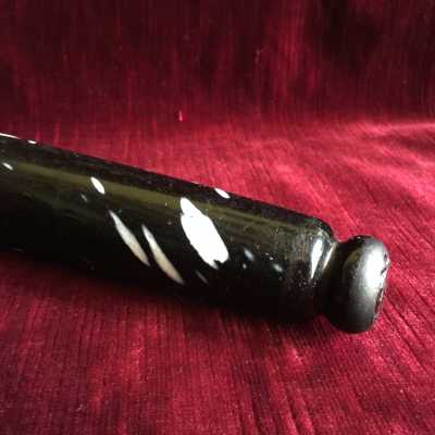 Oblong shape with end cap in button on both sides