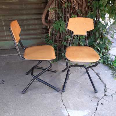 pair of wood and metal chairs