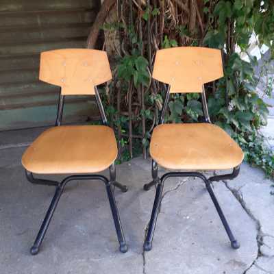 pair of wood and metal chairs