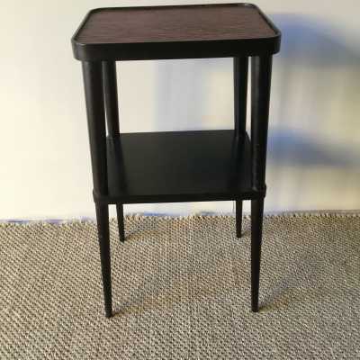 Elegant pedestal table in blackened wood and upper tray in red leather