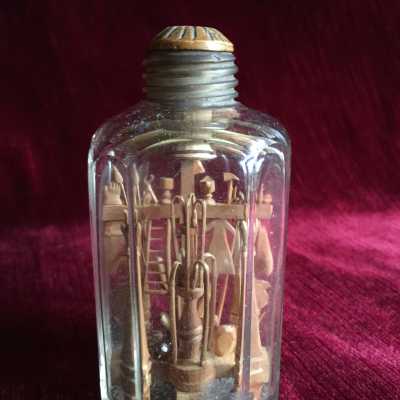 Fruit wood work, rarely twith so many details and objects for these bottles typical of a popular Folk Art born from a tradition of sailors