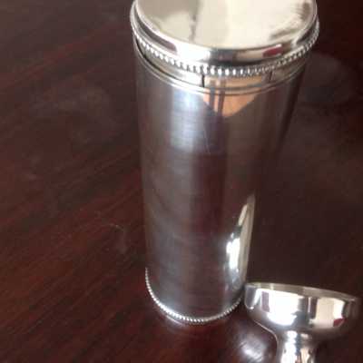Old silver metal thermos