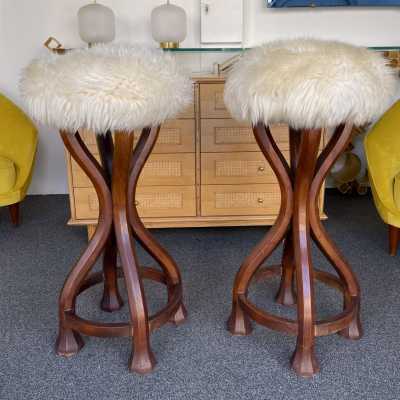 Pair of bar stools in wood and sheepskin. italy 1970 in Art Nouveau style, Art Deco 1940, 1950, 1960, Mid-Century Modern mood. armchairs chairs poufs table side tables lamps floor lamp sconces