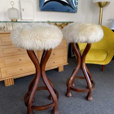 Pair of bar stools in wood and sheepskin. italy 1970 in Art Nouveau style, Art Deco 1940, 1950, 1960, Mid-Century Modern mood. armchairs chairs poufs table side tables lamps floor lamp sconces