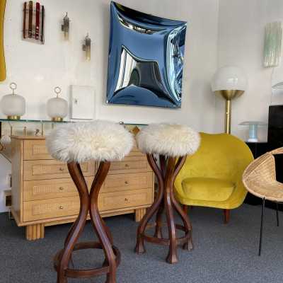 Pair of bar stools in wood and sheepskin. italy 1970 in Art Nouveau style, Art Deco 1940, 1950, 1960, Mid-Century Modern mood. armchairs chairs poufs table side tables lamps floor lamp sconces