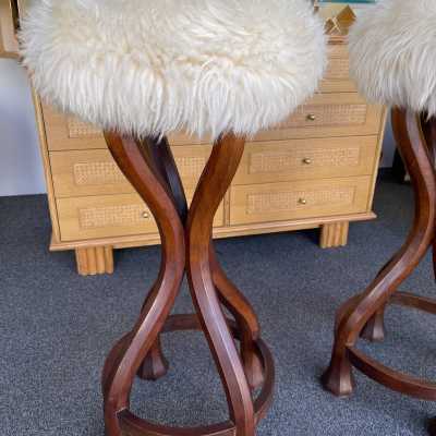Pair of bar stools in wood and sheepskin. italy 1970 in Art Nouveau style, Art Deco 1940, 1950, 1960, Mid-Century Modern mood. armchairs chairs poufs table side tables lamps floor lamp sconces