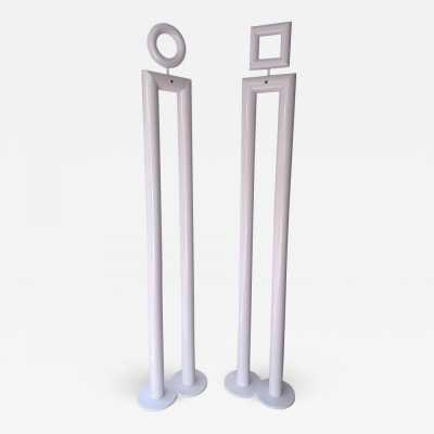 Pair of floor lamps in white lacquered metal model Boy & Girl by Remo Buti for Neofos. Italy 1980. in the style of Memphis group Michele De Lucchi, Matteo Thun, Marco Zanini, Aldo Cibic, Andrea Branzi, Shiro Kuramata, Martine Bedin Masanori Umeda, Joe Colombo, Arteluce, Arredoluce, Lumi, Luci, Rggiani, Sciolari, Pierre Cardin mid-century modern space age chandelier lamps brass metal chrome stainless steel 1970