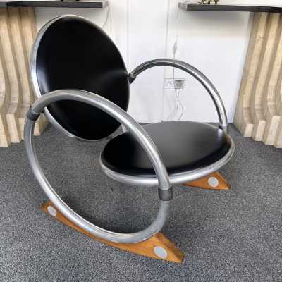 Dondolo rocking chairs in metal, leather and wood by Verner Panton for Ycami. Italy 1990. Created in 1994 by Danish designer. in the style of Gio Ponti, Gianfranco Frattini, Cassina, Osvaldo Borsani, Joe Colombo, Vico Magistretti, Luisa Parisi, Mario Bellini, Tito Agnoli, Afra Tobia Carlo Scarpa, Luciano Frigerio, Sporiti, Marco Zanuso, Giulio Moscatelli, Formanova. mid-century fireside chairs