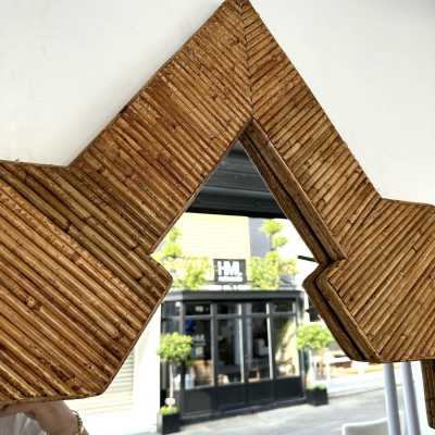 Large Pyramid Rattan Mirror by Vivai Del Sud. Italy 1970. Original publisher's label on the back. in the style of Maison Arpex International, Dal Vera, Renato Zevi, Romeo Rega, Maison Jansen, Mario Sabot. mid-century modern space age hollywood regency brass metal stainless steel bamboo wood