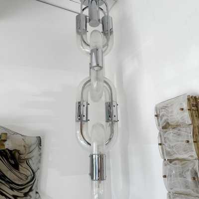 Chandelier suspension pendant lightning chain in Murano glass and chromed metal by Aldo Nason for Mazzega. Italy 1970s. in the style of Venini, Vistosi, La Murrina, Seguso, Carlo Nason, Poliarte, Esperia, Angelo Brotto, Stilnovo, Arteluce, Arredoluce, Artemide, Pierre Cardin, Lumi, Luci, Raak, Angelo Lelii, Francesco Bocola, Superstudio, Enrico Tronconi , Mario Bellini, Harvey Guzzini, Luigi Massoni, Martinelli, Fabio Lenci, Gio Ponti. brass stainless steel mid-century modern space age lamps sconces