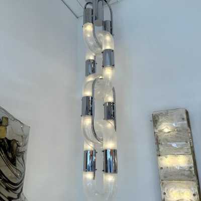 Chandelier suspension pendant lightning chain in Murano glass and chromed metal by Aldo Nason for Mazzega. Italy 1970s. in the style of Venini, Vistosi, La Murrina, Seguso, Carlo Nason, Poliarte, Esperia, Angelo Brotto, Stilnovo, Arteluce, Arredoluce, Artemide, Pierre Cardin, Lumi, Luci, Raak, Angelo Lelii, Francesco Bocola, Superstudio, Enrico Tronconi , Mario Bellini, Harvey Guzzini, Luigi Massoni, Martinelli, Fabio Lenci, Gio Ponti. brass stainless steel mid-century modern space age lamps sconces