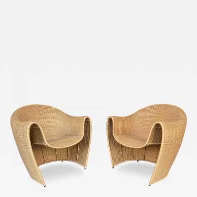 Mid-Century Modern style pair of King Tubby rattan wicker armchairs or lounge chairs by the designer Platt and Young for the quality and famous Italian design editor Driade from the 1990s, (1998). Famous design like Gio Ponti, Gianfranco Frattini, Cassina, Osvaldo Borsani, Joe Colombo, Vico Magistretti, Luisa Parisi, Mario Bellini, Tito Agnoli, Afra Tobia Carlo Scarpa, Luciano Frigerio, Sporiti, Marco Zanuso, Giulio Moscatelli, Formanova, Maxalto, Alvar Aalto. mid-century modern space age hollywood regency