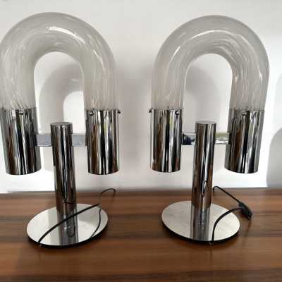 Mid-Century Modern Space Age pair of or set of 2 table lamps by Aldo Nason for the manufacture Mazzega. Metal chrome and Blown Murano glass. Famous manufacture like Venini, Vistosi, La Murrina, Seguso, Carlo Nason, Poliarte, Esperia, Angelo Brotto, Stilnovo, Arteluce, Arredoluce, Artemide, Pierre Cardin, Lumi, Luci, Raak, Angelo Lelii, Francesco Bocola, Superstudio, Enrico Tronconi, Mario Bellini, Harvey Guzzini, Luigi Massoni, Martinelli, Fabio Lenci, Gio Ponti. brass wood 1960s 1950s