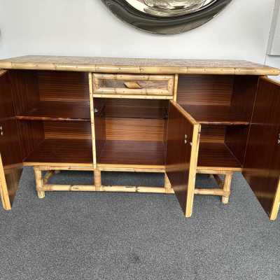 Mid-Century Modern Dry bar cabinet or buffet credenza in wood, bamboo, bamboo marquetry, doors decor with cow leather, glass shelf. Italian design attributed to the Dal Vera factory for the very typical marquetry top. Famous design like Mario Sabot, Maison Jansen, Hollywood Regency, Gio Ponti, Gianfranco Frattini, Cassina, Osvaldo Borsani, Joe Colombo, Vico Magistretti, Ico Luisa Parisi, Mario Bellini, Tito Agnoli, Afra Tobia Carlo Scarpa, Luciano Frigerio, Sporiti, Formanova , brass metal 1960s 1950s