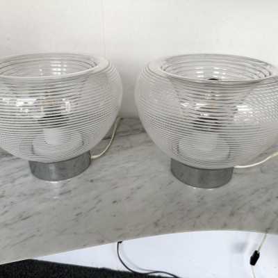 Pair of table or bedside lamps in metal chrome, white and clear stripe blown Murano glass by the Italian designer editor VeArt. Famous design like Mazzega, Venini, Vistosi, Veronese, La Murrina, Aldo Carlo Nason, Stilnovo, Joe Colombo, Arteluce, Arredoluce, Lumi, Luci, Rggiani, Sciolari, Werner Pantone, Raak, Angelo Brotto, Esperia, Francesco Bocola, Enrico Tronconi , Mario Bellini, Harvey Guzzini, Luigi Massoni, Martinelli, Pierre Cardin,. Mid-Century modern space age brass wood 1960s 1950s 1980s