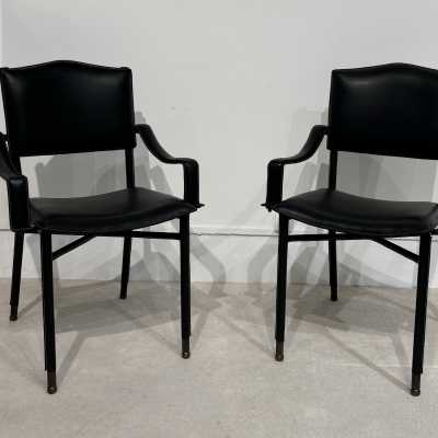 Pair of Jacques Adnet armchairs