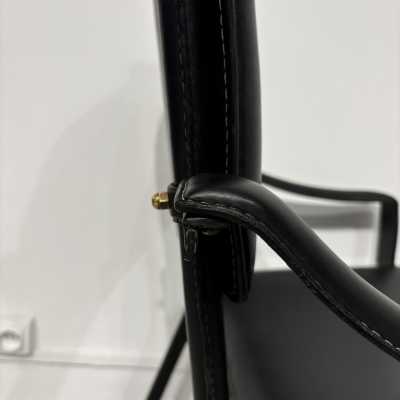 Pair of Jacques Adnet armchairs