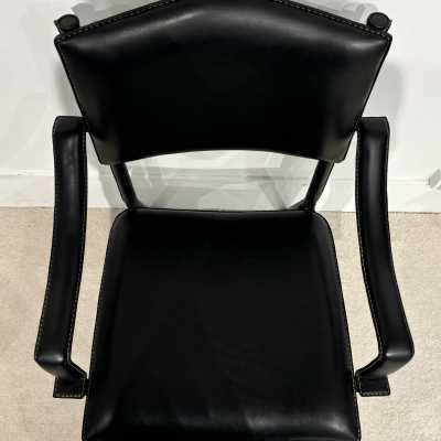 Pair of Jacques Adnet armchairs