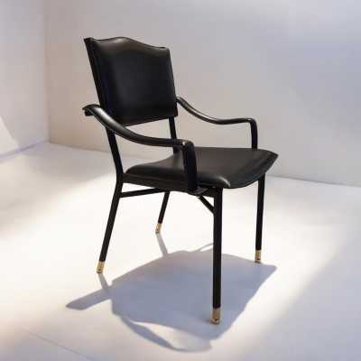 Pair of Jacques Adnet armchairs