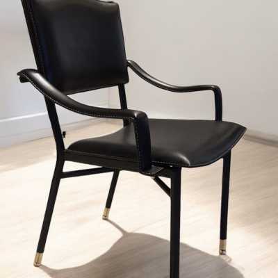 Pair of Jacques Adnet armchairs