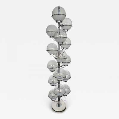 Rare, tall, Space Age-style floor lamp from the Italian manufacturer Candle, made of chrome-plated metal and white smoked glass globes. Renowned manufacturers include Fontana Arte, Sarfatti, Artemide, Arredoluce, Sciolari, Reggiani, Arlus, Stilnovo, Angelo Lelii Esperia, and Hollywood Regency.