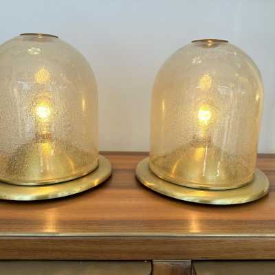 Pair of Space Age style table or bedside lamps in brass and gilded bubbled Murano glass by F. Fabbian. Famous designs by: Carlo Aldo Nason for Mazzega, Venini, Vistosi, La Murrina, Poliarte, Stilnovo, Arteluce, Arredoluce, Angelo Brotto for Esperia, Fontana Arte and Cristal Art.