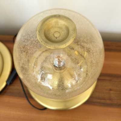 Pair of Space Age style table or bedside lamps in brass and gilded bubbled Murano glass by F. Fabbian. Famous designs by: Carlo Aldo Nason for Mazzega, Venini, Vistosi, La Murrina, Poliarte, Stilnovo, Arteluce, Arredoluce, Angelo Brotto for Esperia, Fontana Arte and Cristal Art.