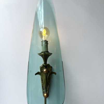 Mid-century modernist wall sconces, glass and gilded bronze lighting sconces. In the atmosphere of Pietro Chiesa for the Italian design factory Fontana Arte. Famous designs like Reggiani, Sciolari, Francesco Buzzi Ceriani, Angelo Brotto for Esperia, Aldo Carlo Nason for Mazzega, Venini, Vistosi, La Murrina, Toni Zuccheri, Fontana Arte, Artemide, Arteluce, Arredoluce, Luigi Caccia Dominioni, Stilnovo.