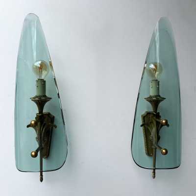 Mid-century modernist wall sconces, glass and gilded bronze lighting sconces. In the atmosphere of Pietro Chiesa for the Italian design factory Fontana Arte. Famous designs like Reggiani, Sciolari, Francesco Buzzi Ceriani, Angelo Brotto for Esperia, Aldo Carlo Nason for Mazzega, Venini, Vistosi, La Murrina, Toni Zuccheri, Fontana Arte, Artemide, Arteluce, Arredoluce, Luigi Caccia Dominioni, Stilnovo.